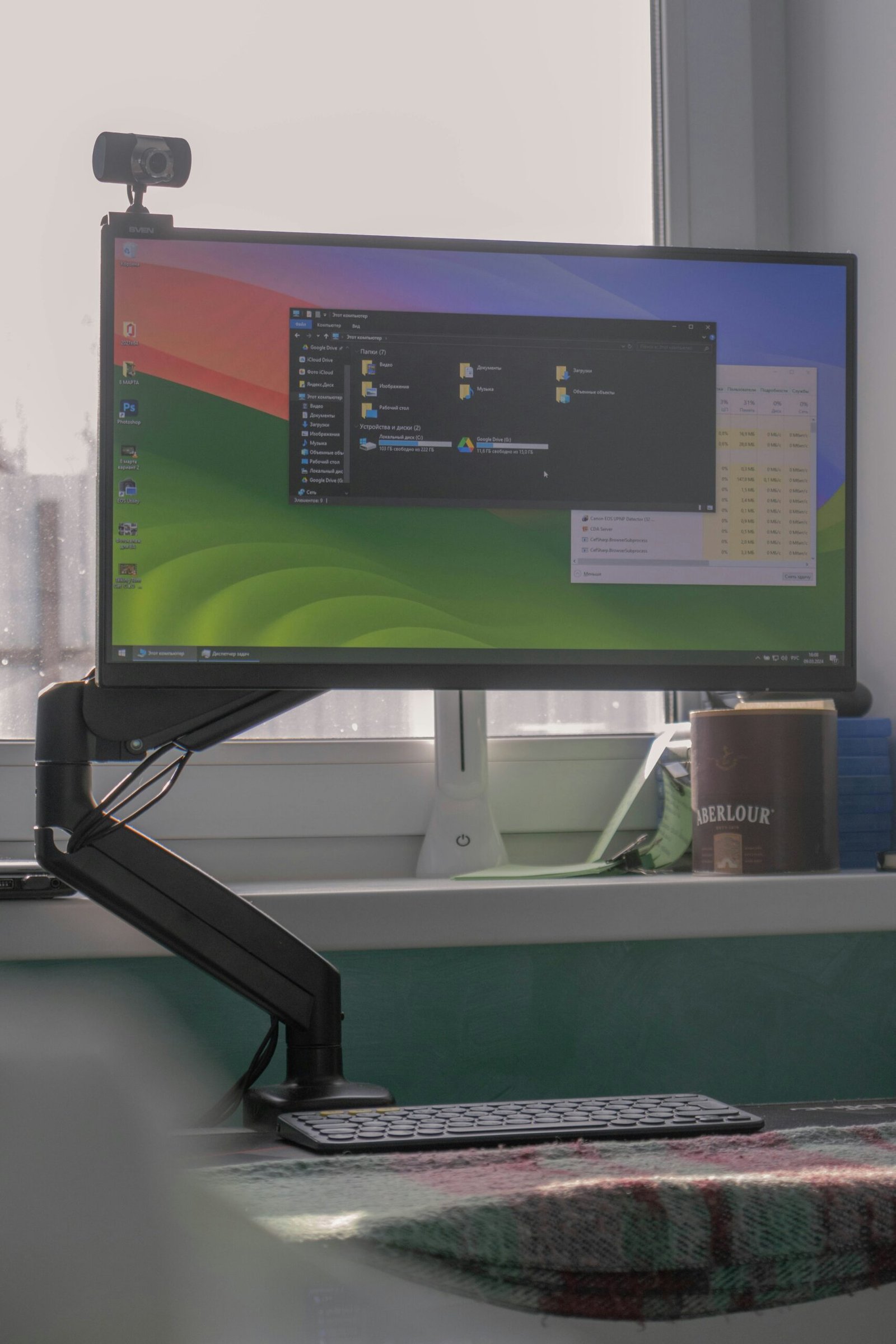 monitor height setup showing screen at eye level on adjustable arm